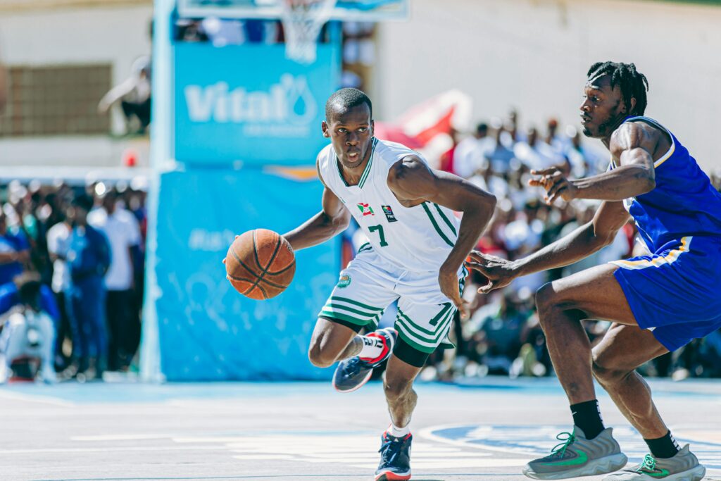 Exciting outdoor basketball match capturing competitive players in action.